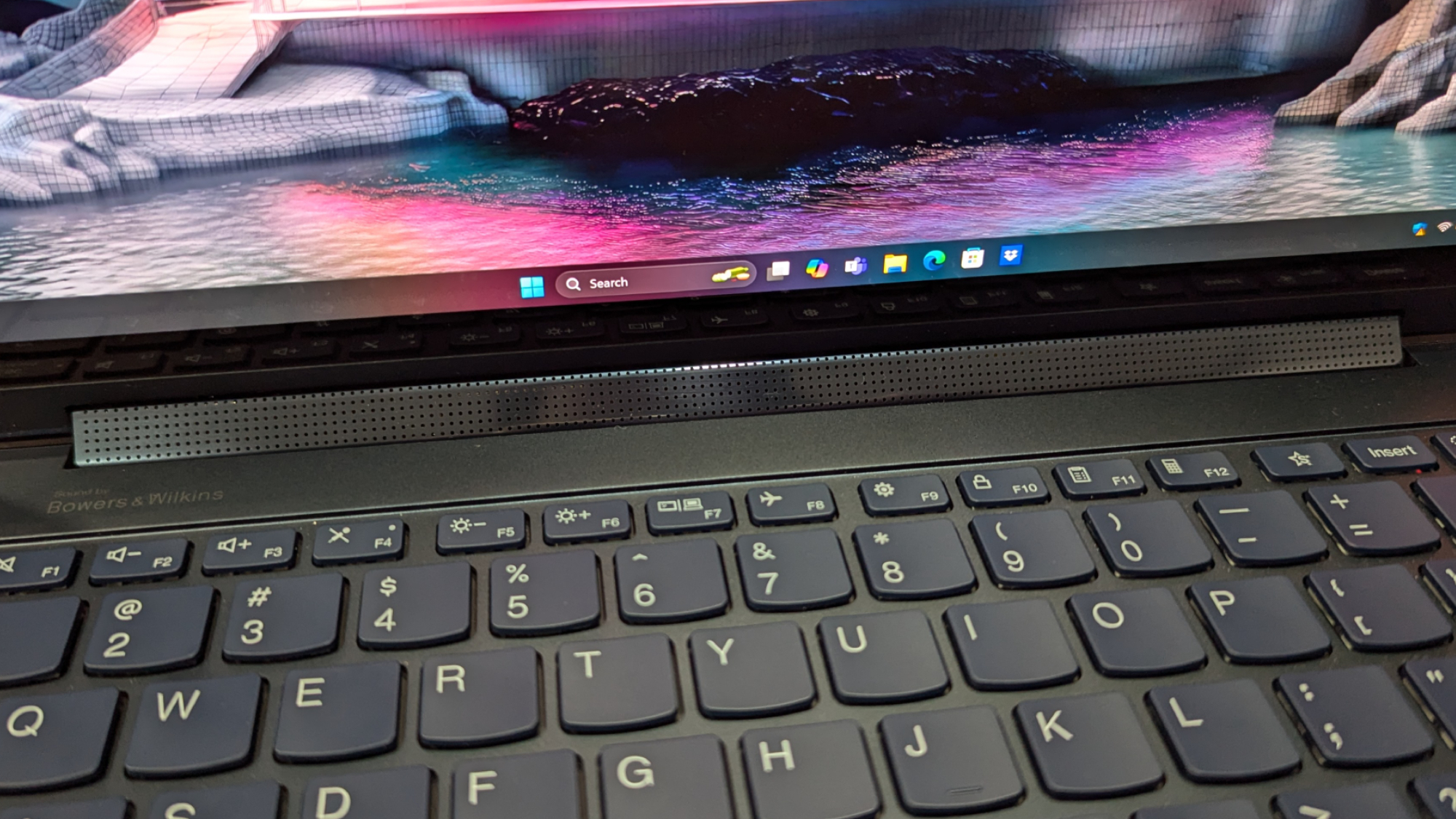 View of rotating Bowers & Wilkins soundbar on Lenovo Yoga 9i Gen 9 laptop