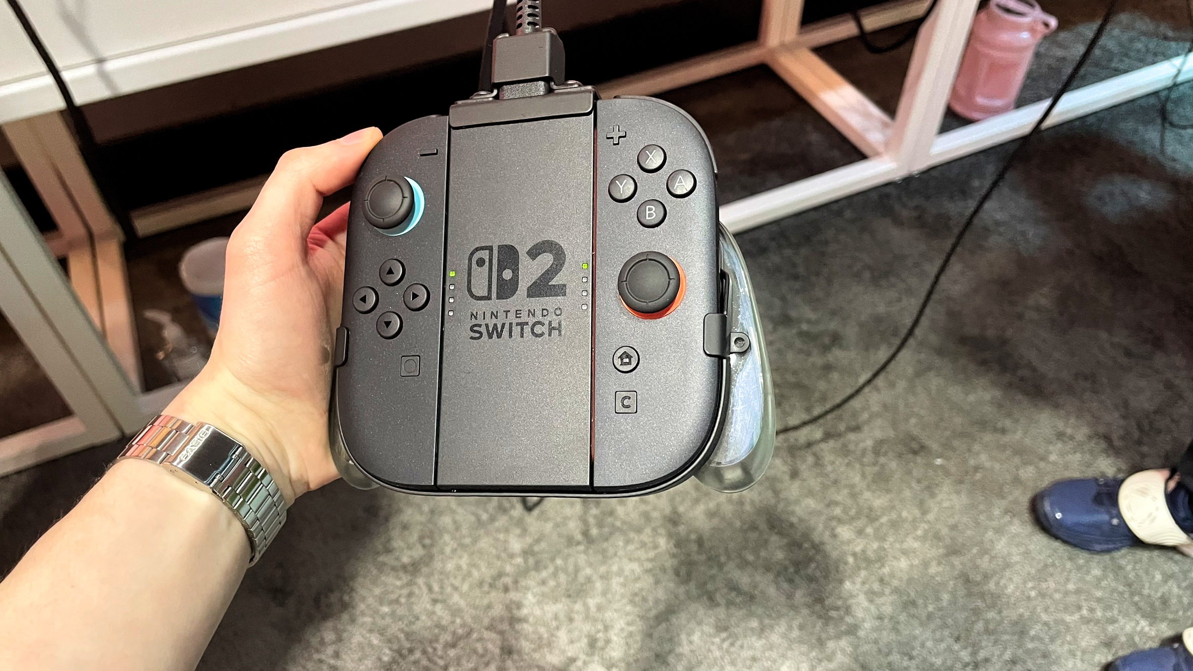 A hand holding the Switch 2 Joy-Cons at the Switch 2 NYC preview event on April 4, 2025