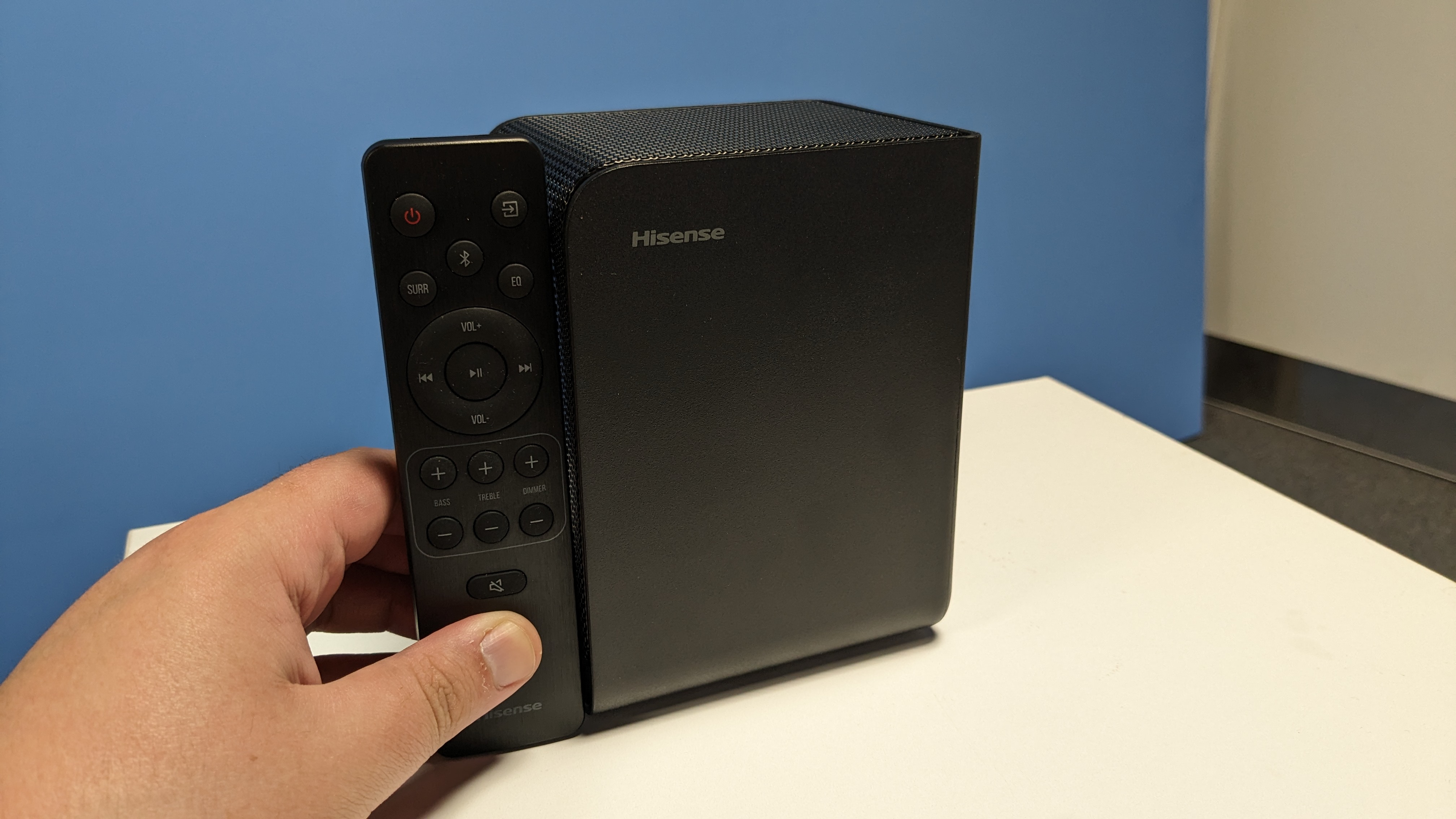 Hisense AX5125H rear speaker next to remote