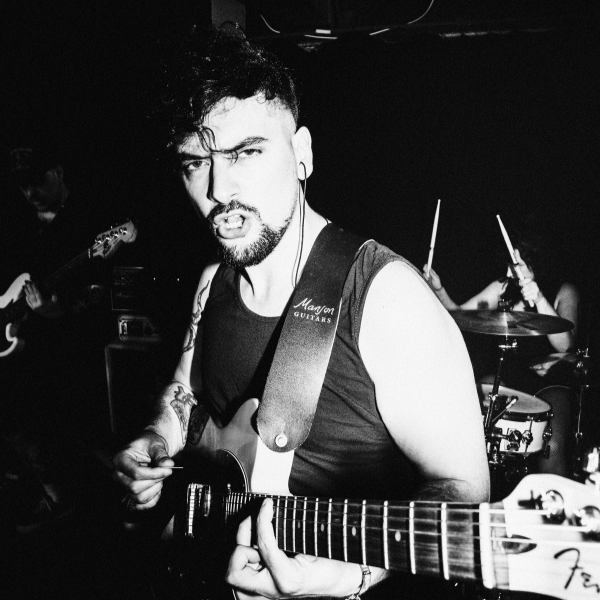 MusicRadar author Matt McCracken playing guitar on stage