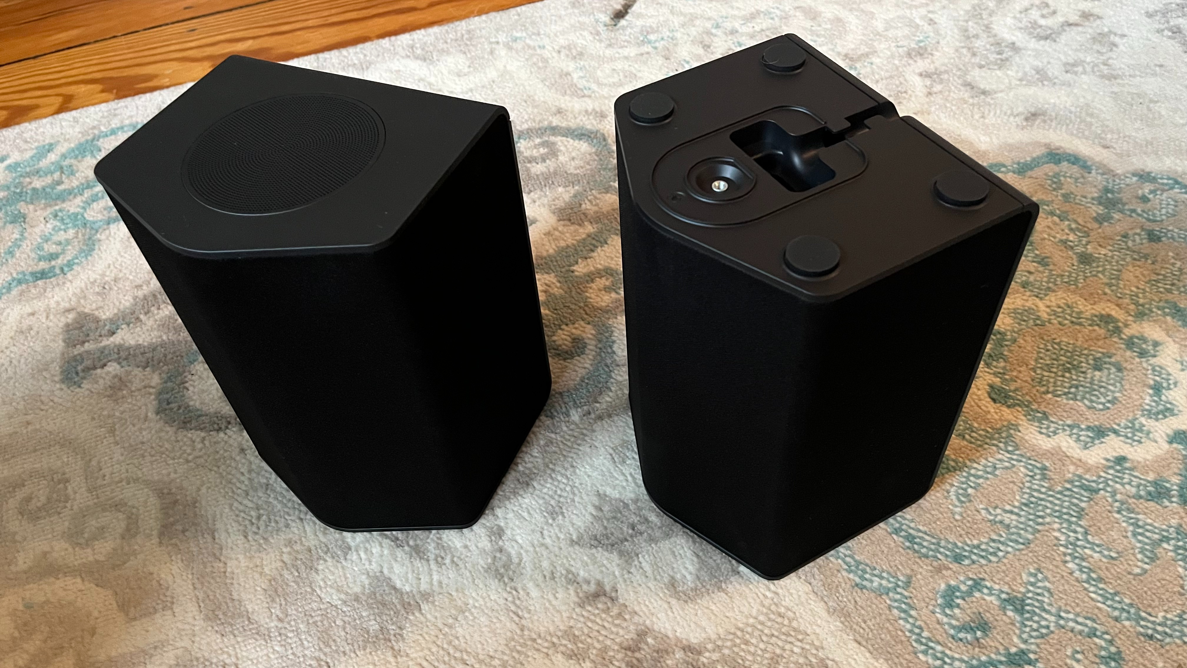 LG S95TR rear speakers on floor in living room
