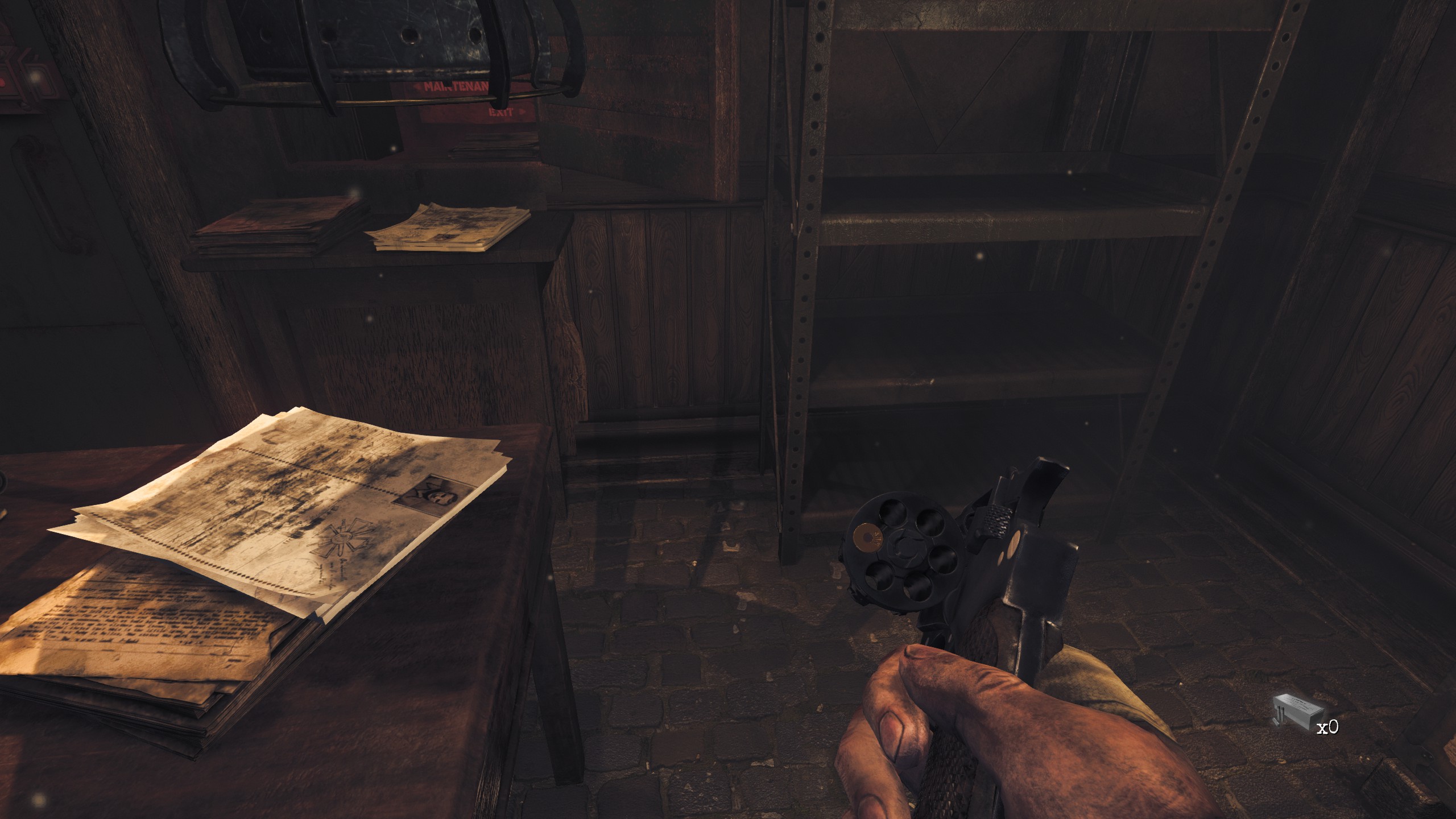 holding open revolver chamber revealing single loaded bullet