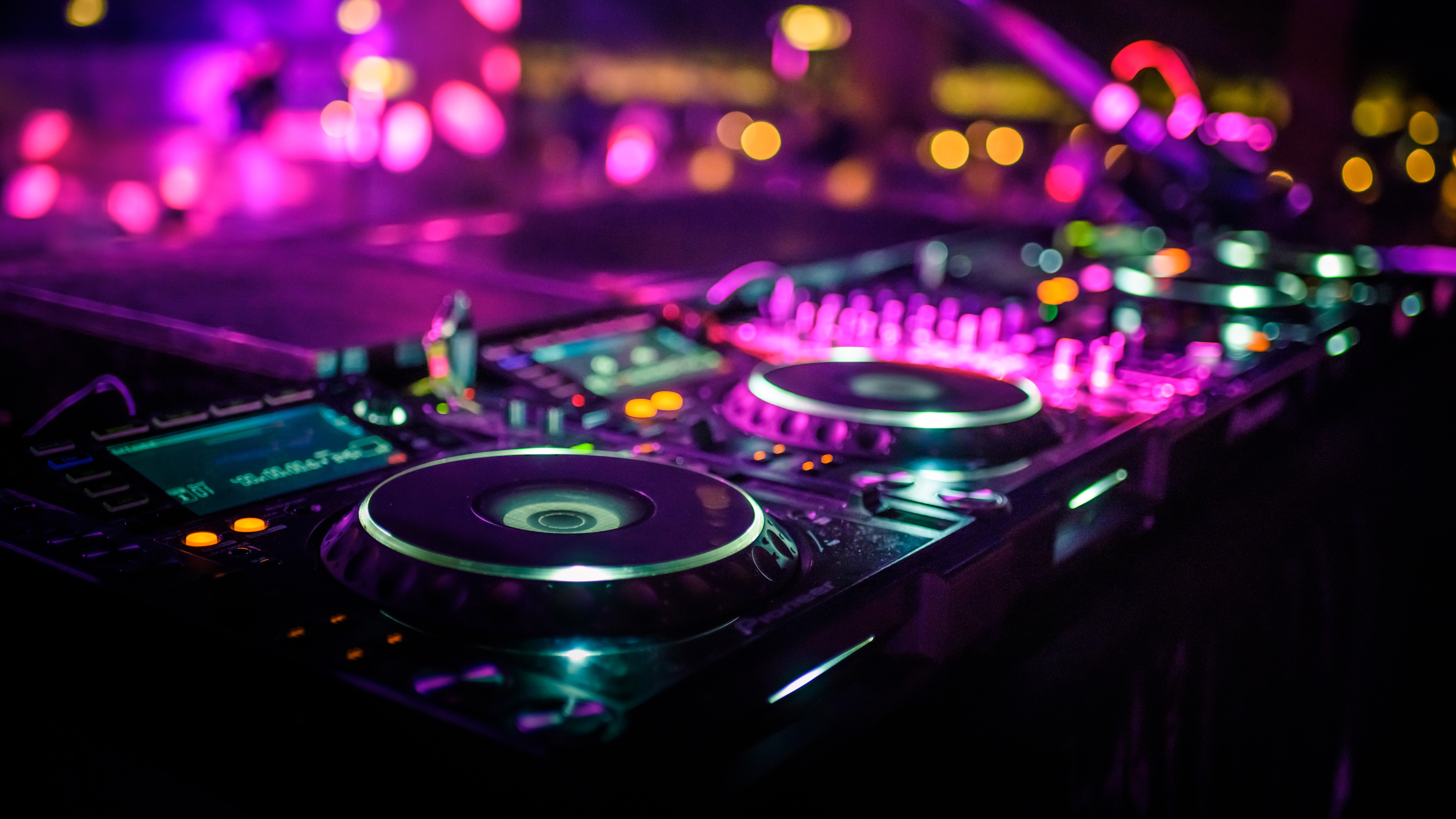 Closeup shot of a turntable and mixer on a stage