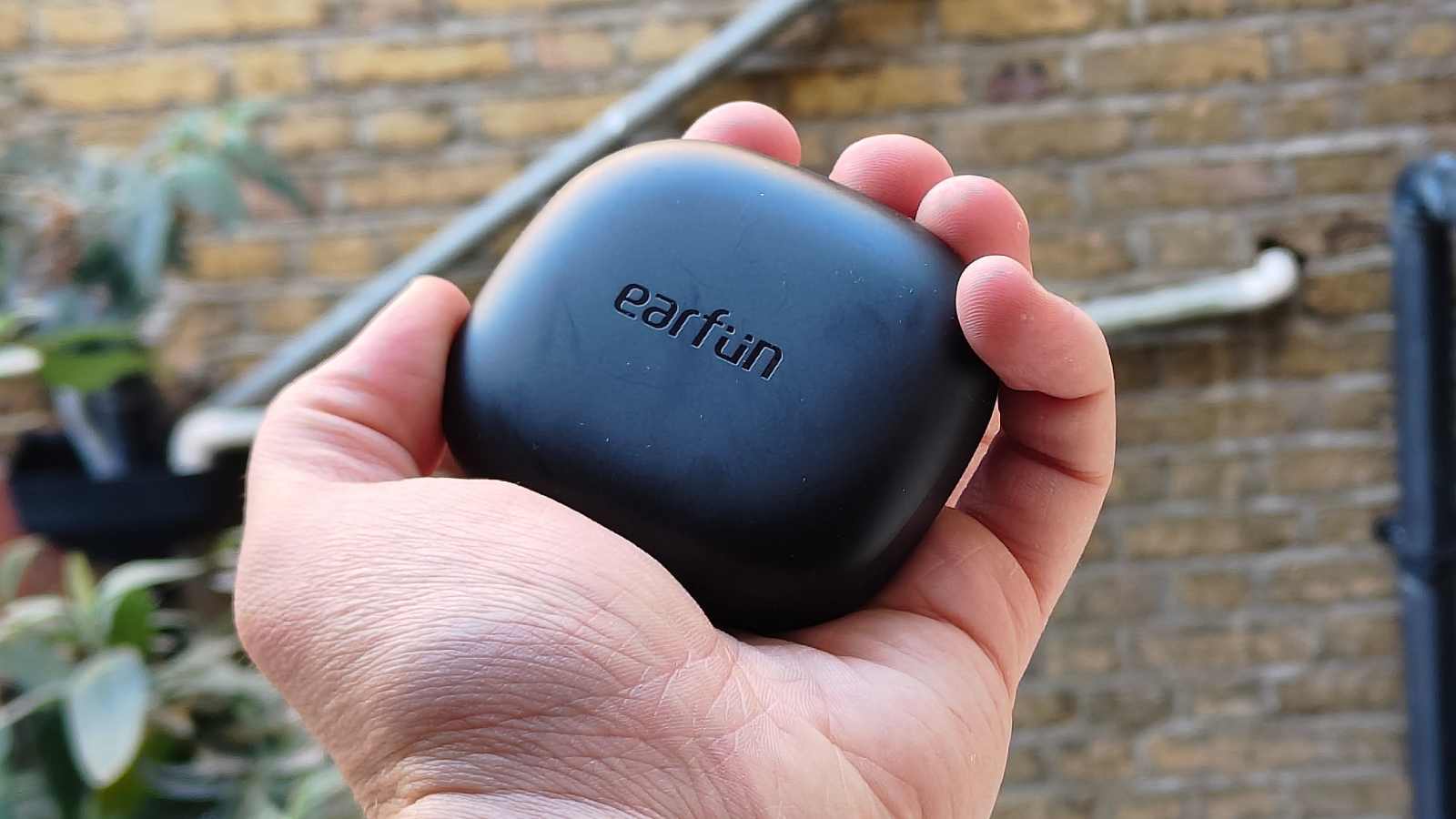 The Earfun OpenJump on a white ledge.