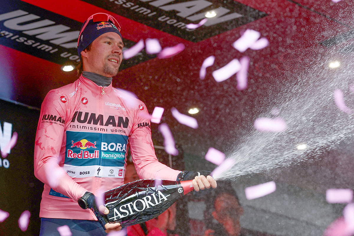 Red Bull-Bora-Hansgrohe's Slovenian rider Primoz Roglic celebrates celebrates his pink jersey of the overall leader on the podium after the 7th stage of the 108th Giro d'Italia cycling race 168kms from Castel di Sangro to Tagliacozzo on May 16, 2025. (Photo by Luca Bettini / AFP)