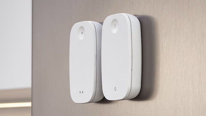 Two IKEA smart buttons on a wall