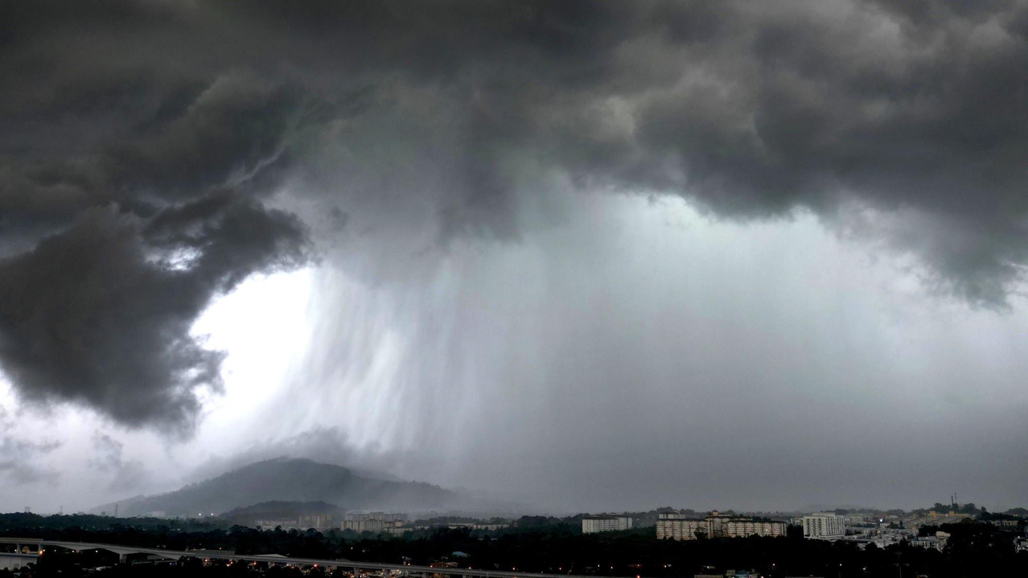 A stock image of a storm with heavy rain.