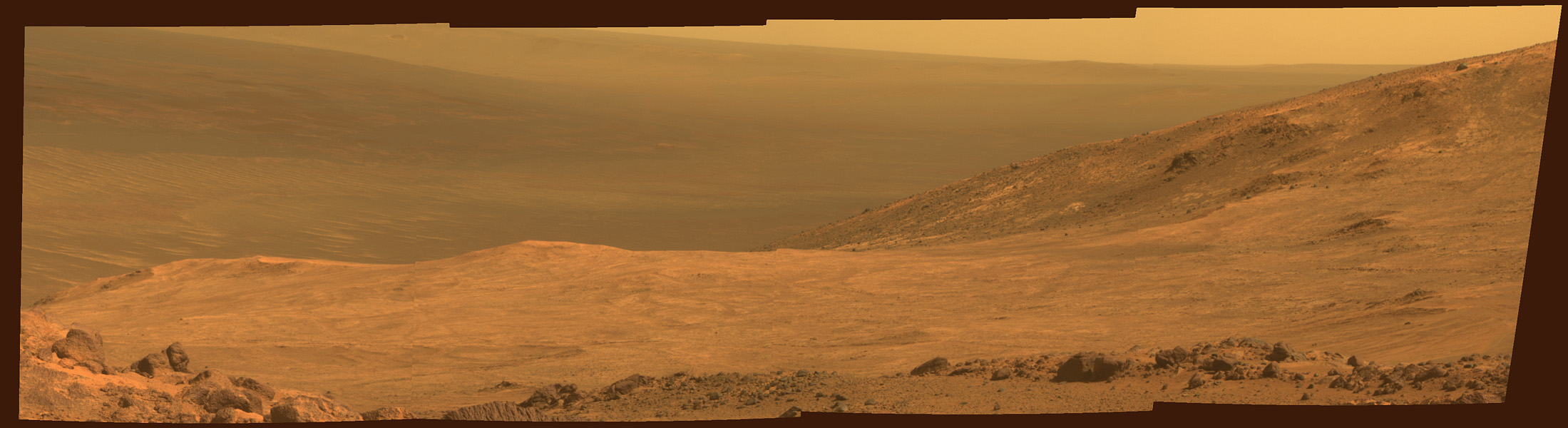 This view from NASA's Opportunity Mars rover shows part of Marathon Valley, a destination on the western rim of Endeavour Crater, as seen from an overlook north of the valley. The image was taken on March 13, 2015 by the rover's PanCam.
