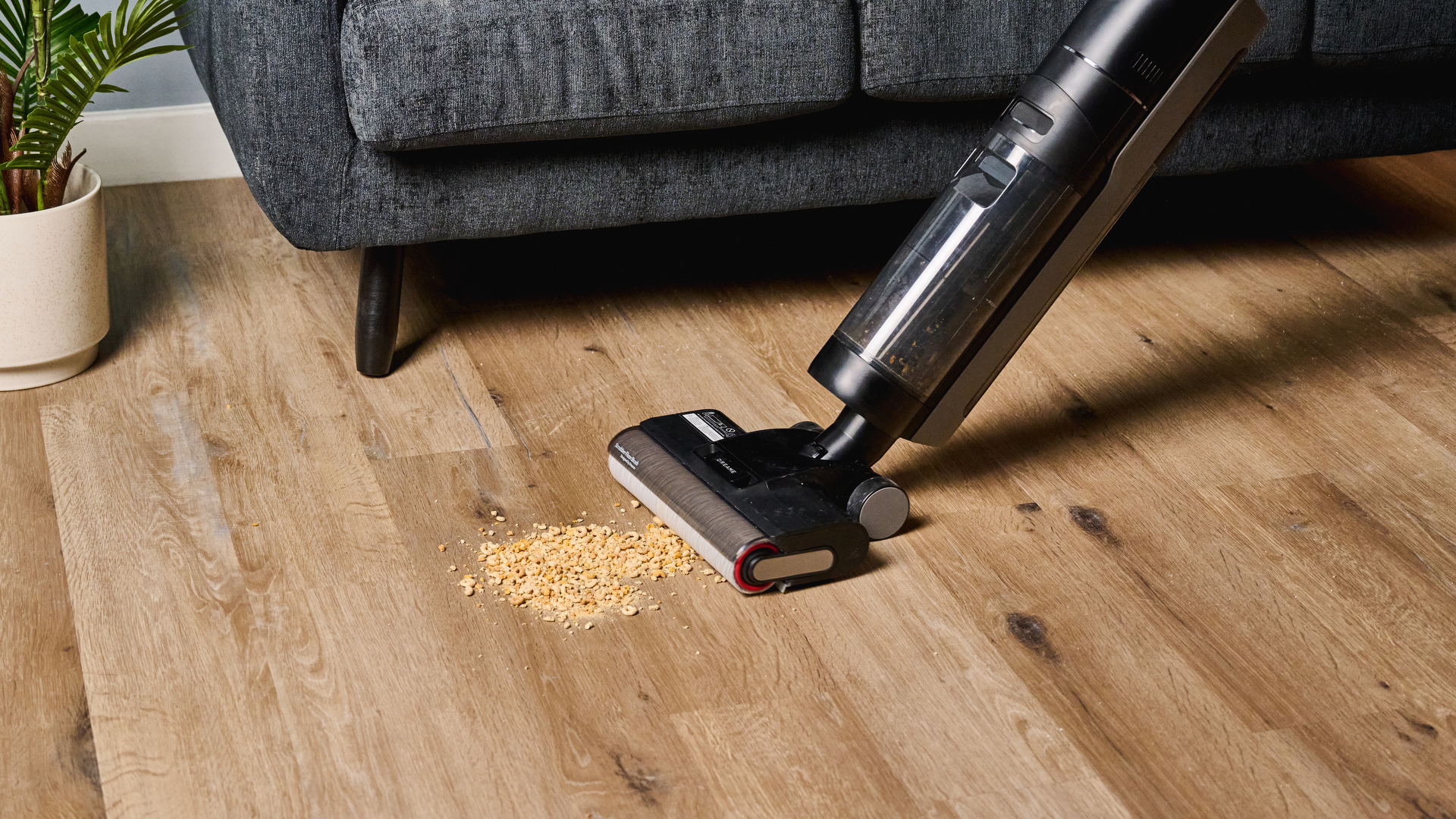 the dreame h12 pro wet and dry vacuum cleaner with a roller brush and a black exterior with two water tanks for clean and dirty water