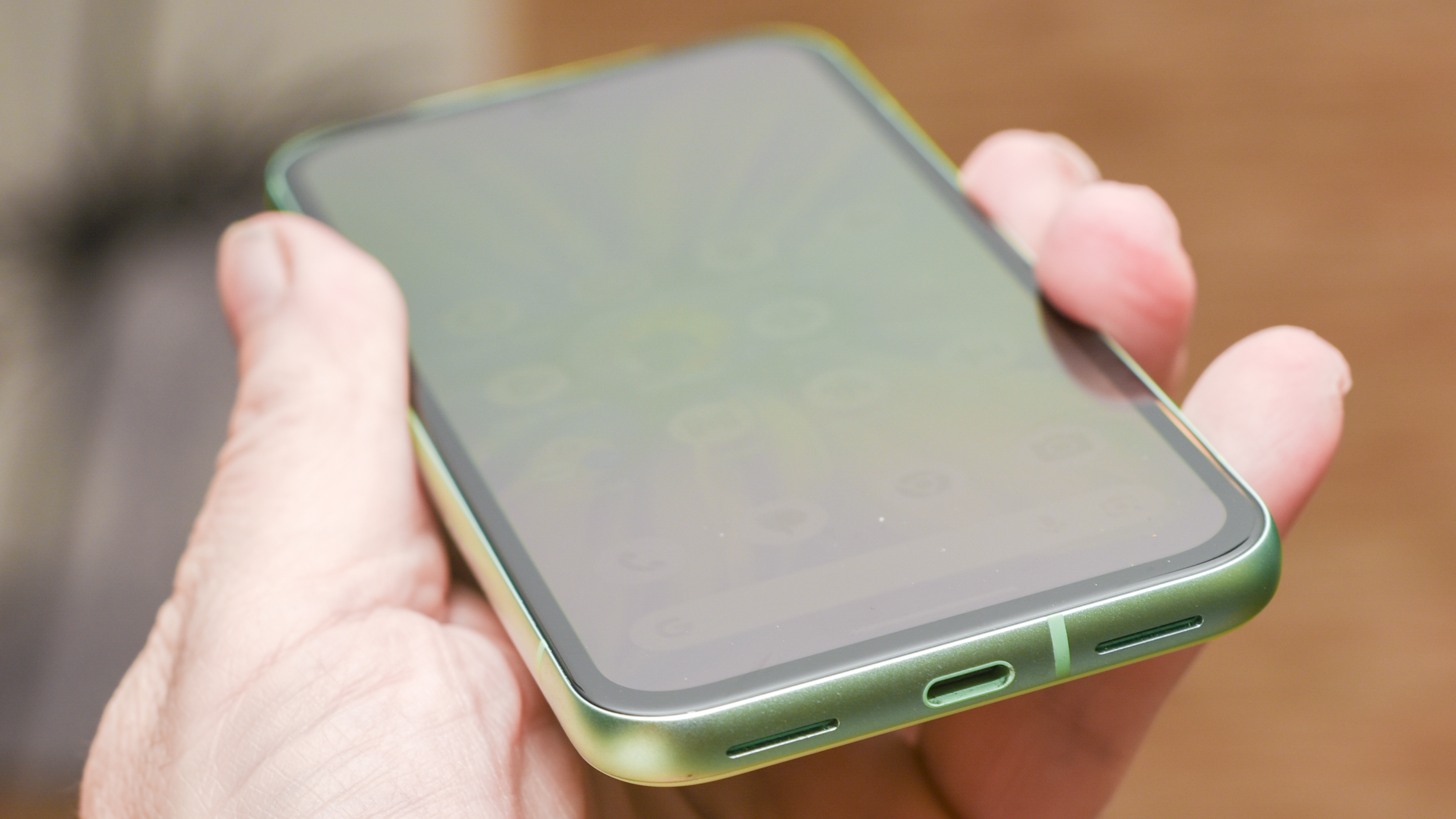 Google Pixel 8a in aloe green showing