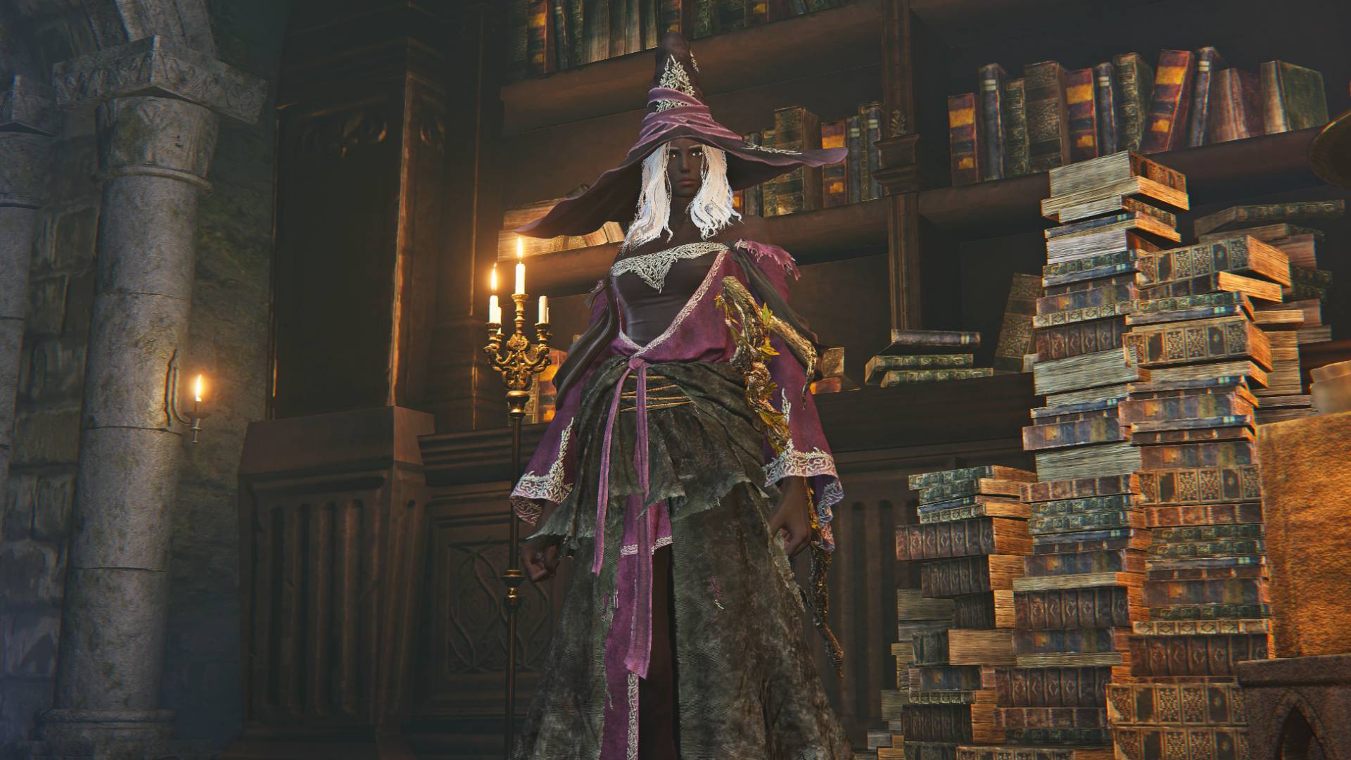 Elden Ring Nightreign Recluse build: Recluse standing next to a bookcase in the Roundtable Hold.