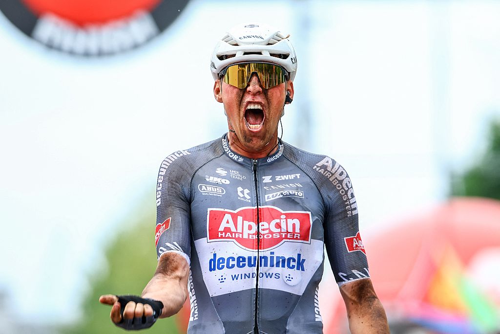 Belgian Timo Kielich of Alpecin-Deceuninck celebrates as he crosses the finish line to win the 'Antwerp Port Epic men's elite one day cycling race, 182 km in and around Antwerp, second race (2/8) in the Lotto Belgium Cup, Sunday 08 June 2025. BELGA PHOTO DAVID PINTENS (Photo by DAVID PINTENS / BELGA MAG / Belga via AFP)