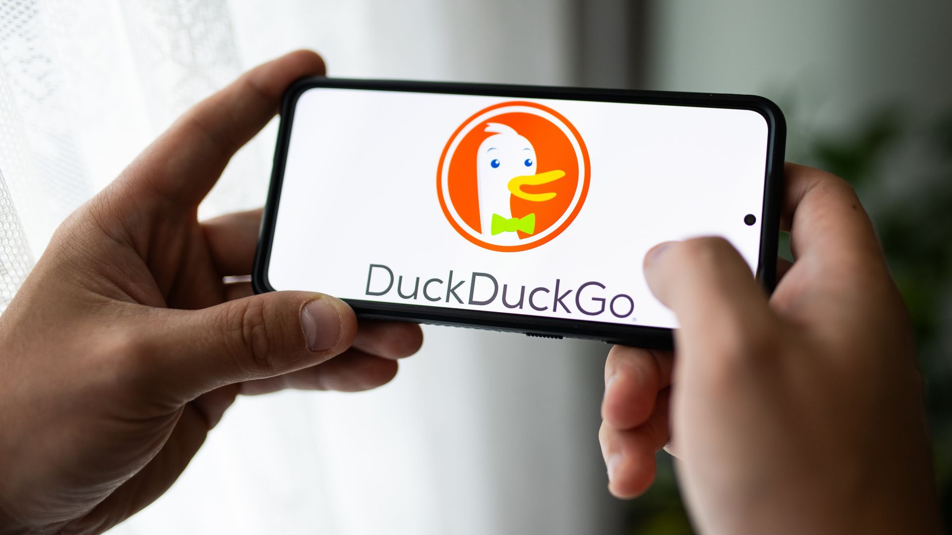 In this photo illustration a DuckDuckGO logo seen displayed on a smartphone.