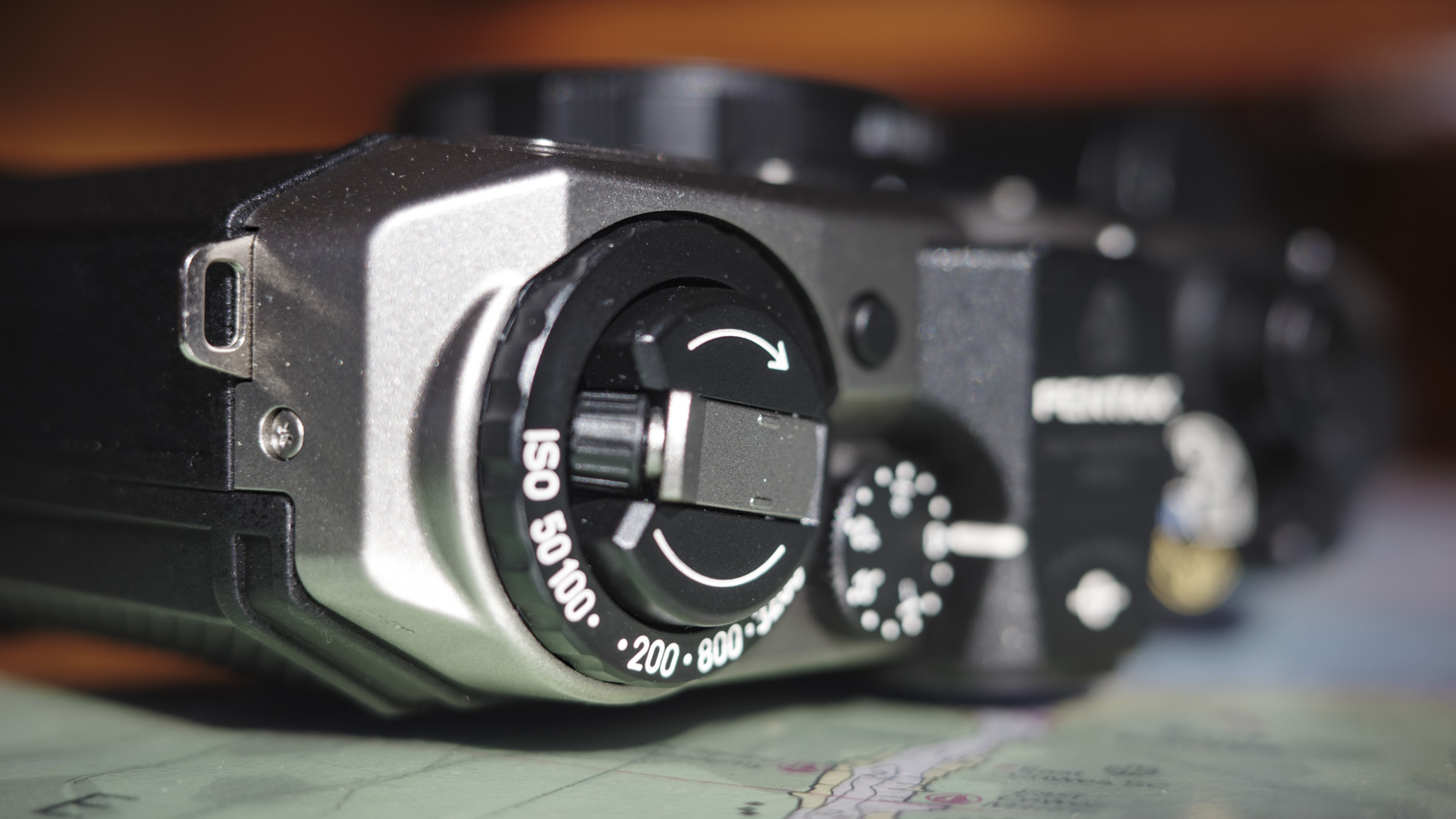 Close up of the Pentax 17 compact film camera's ISO dial